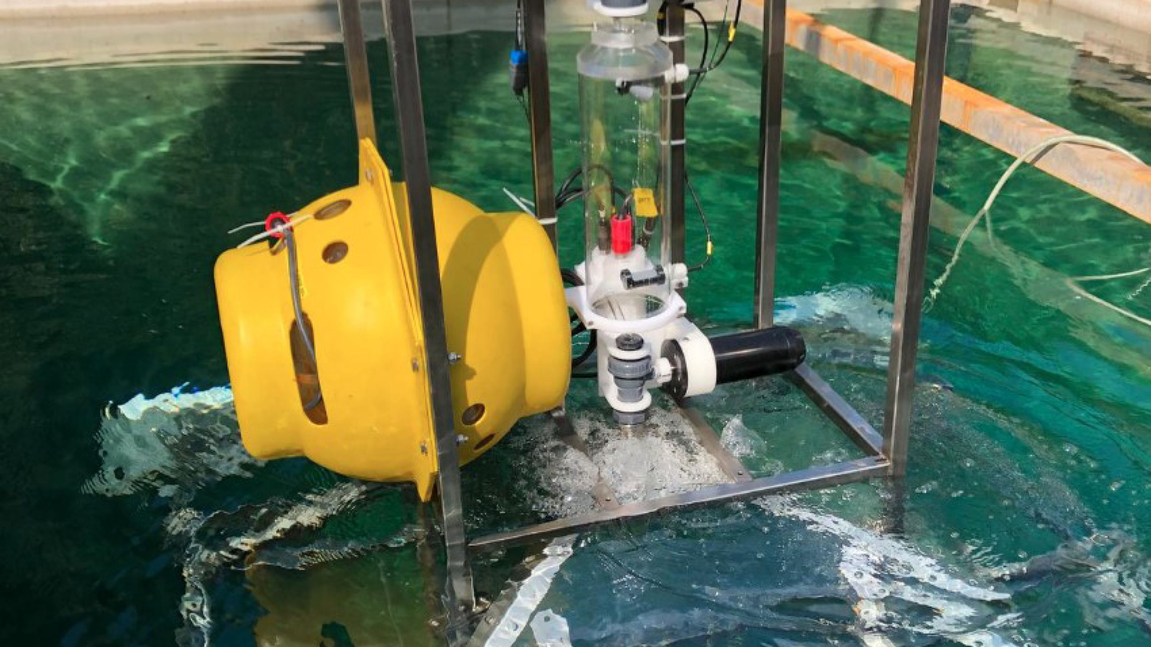Photo of an experimental setting with various containers and water in a lab