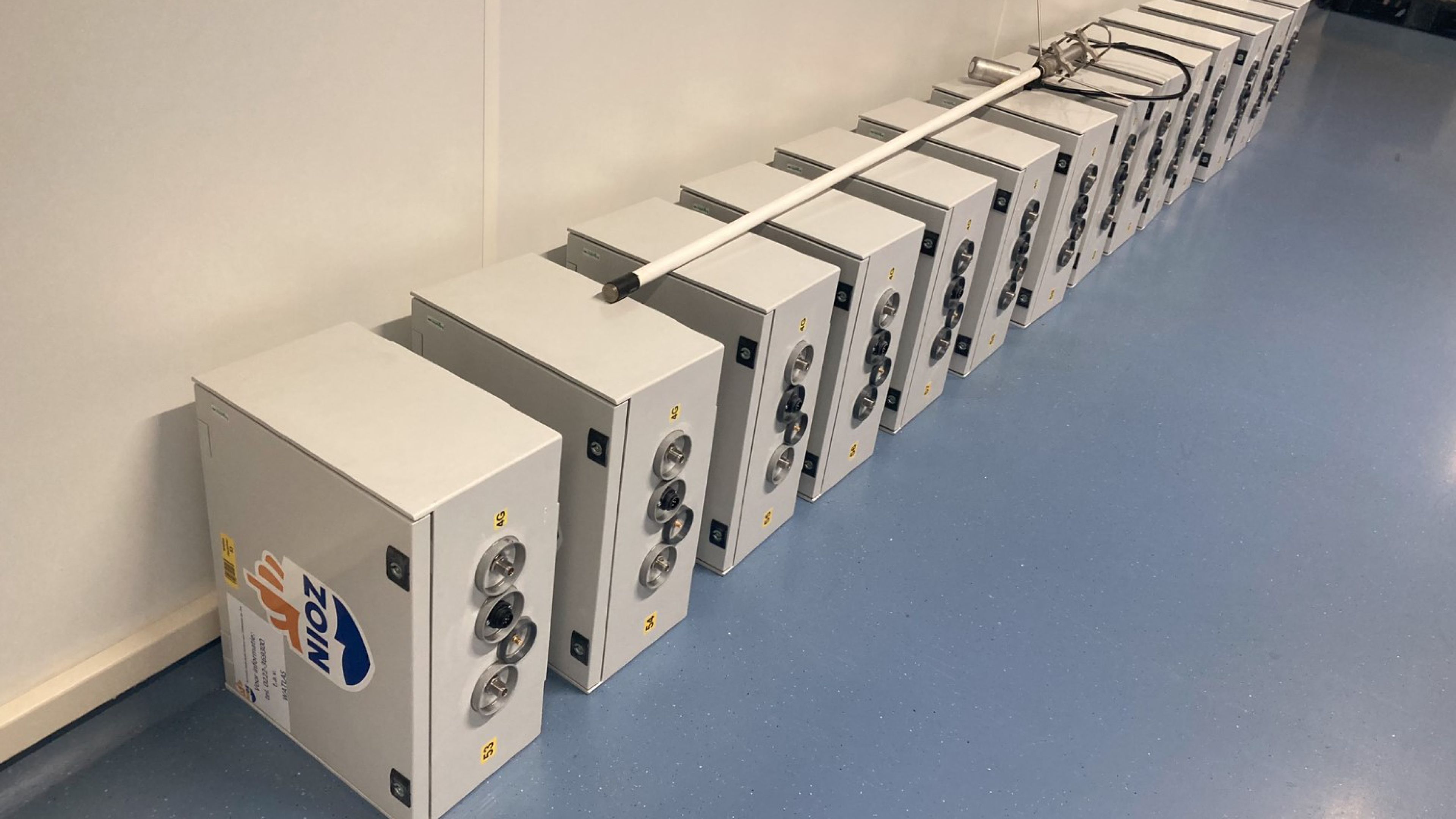 Photo of a row of cubical scientific instruments