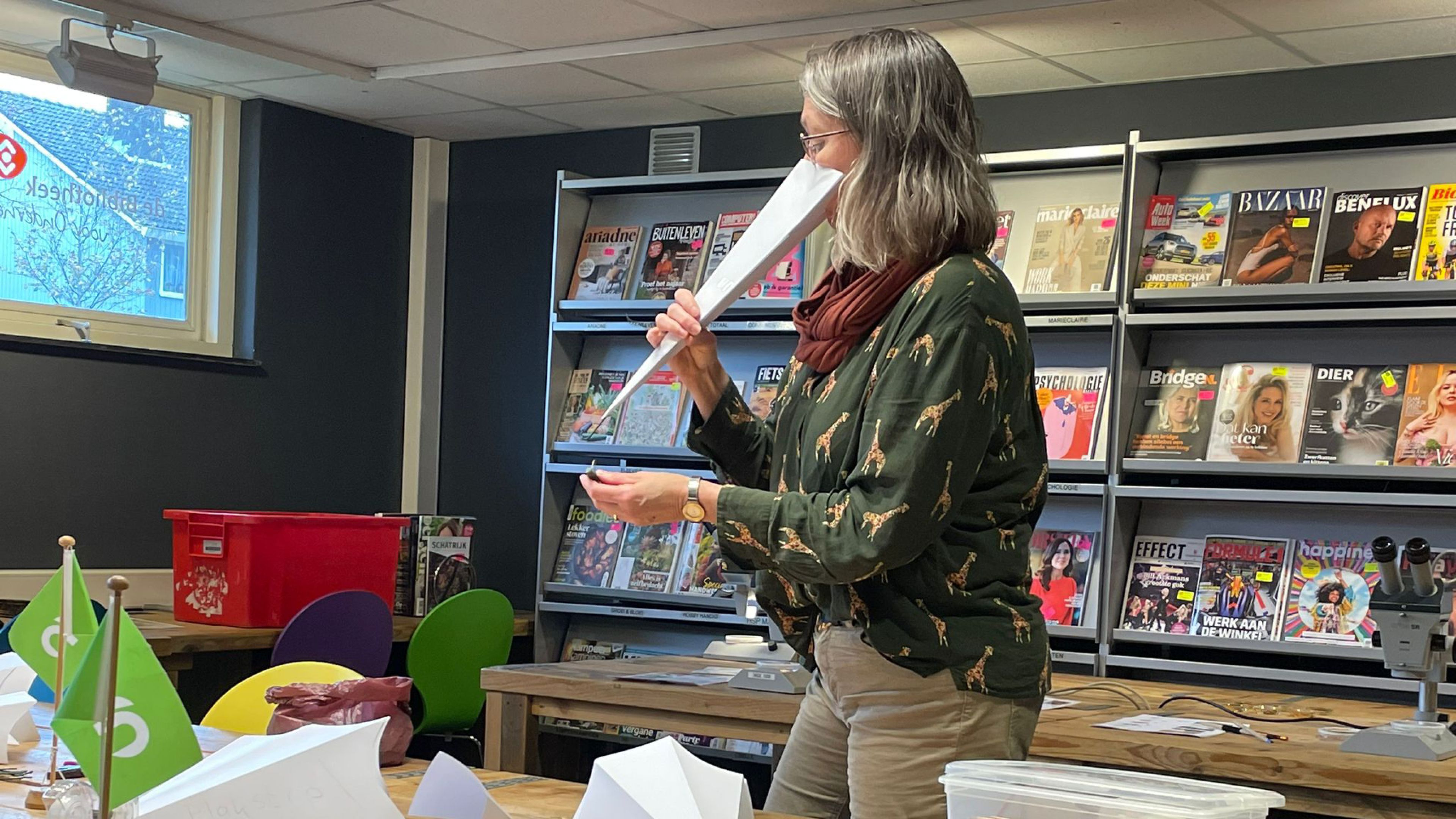 Photo of Evy Gobbens wearing a folded paper beak