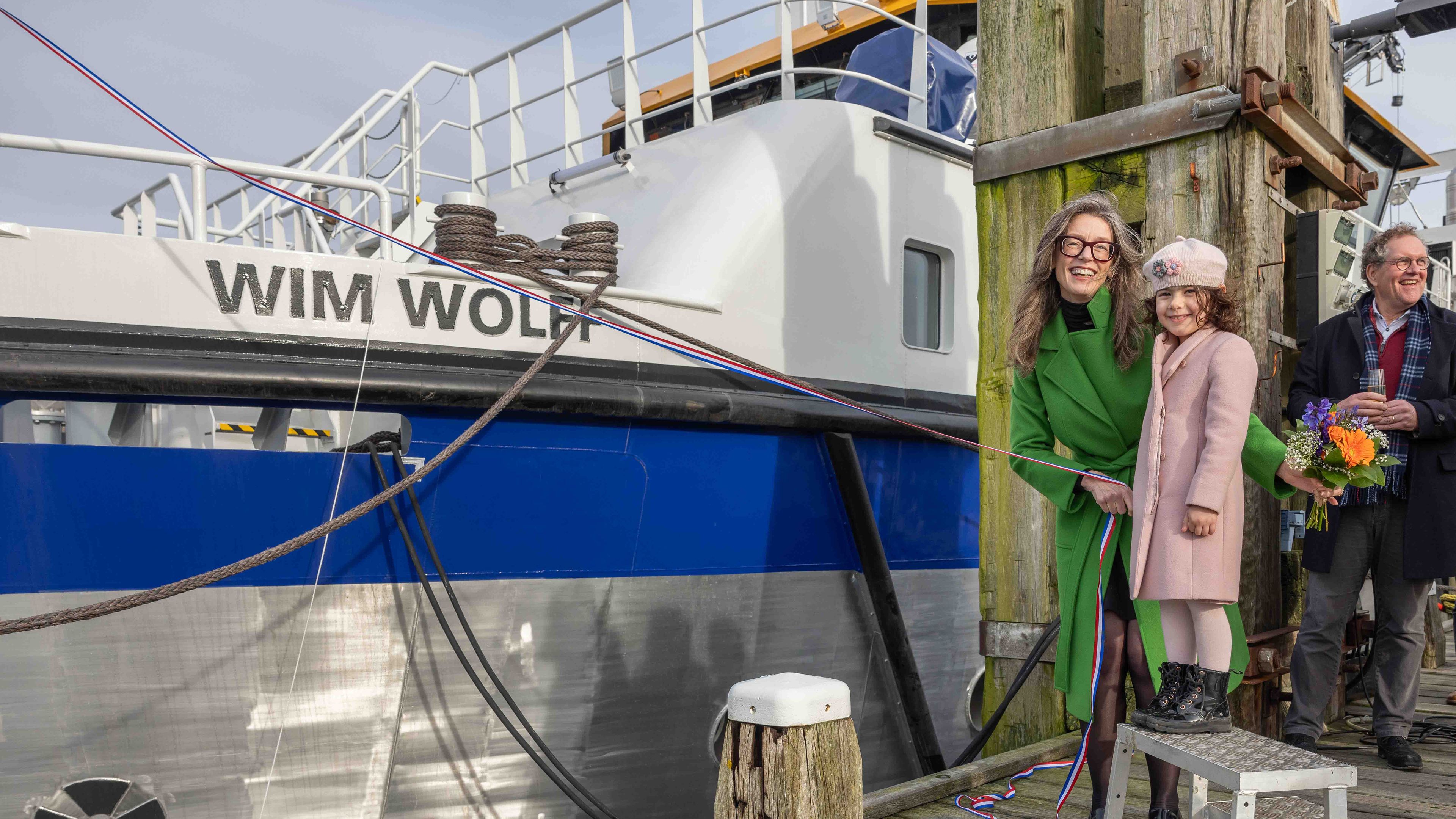 Photo of the christening of the ship called Wim Wollf