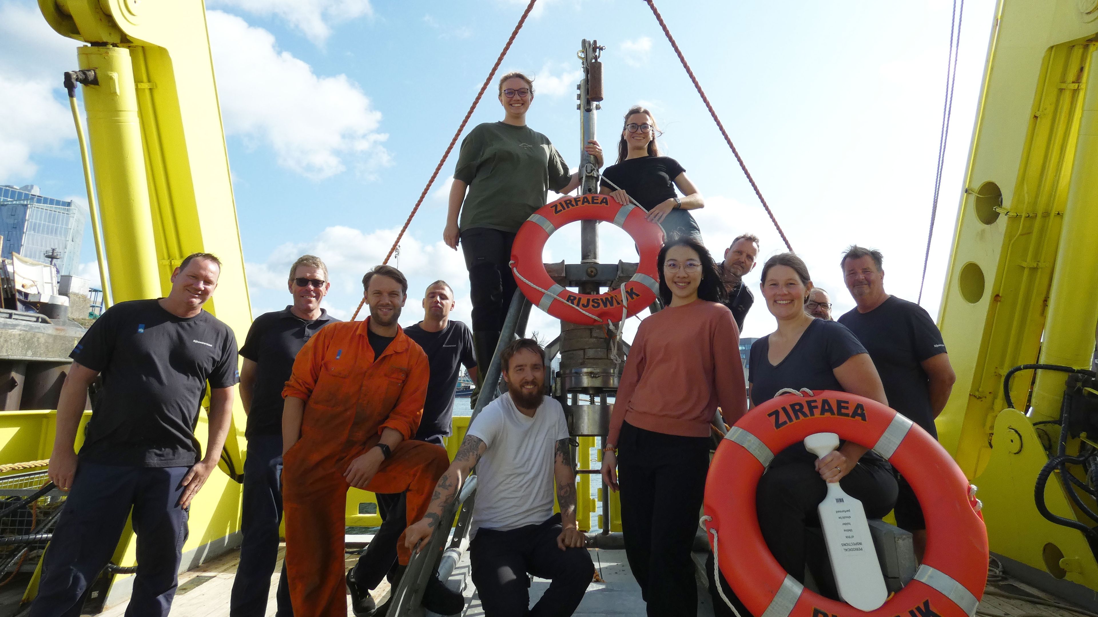 Group of people on deck of a research vessel
