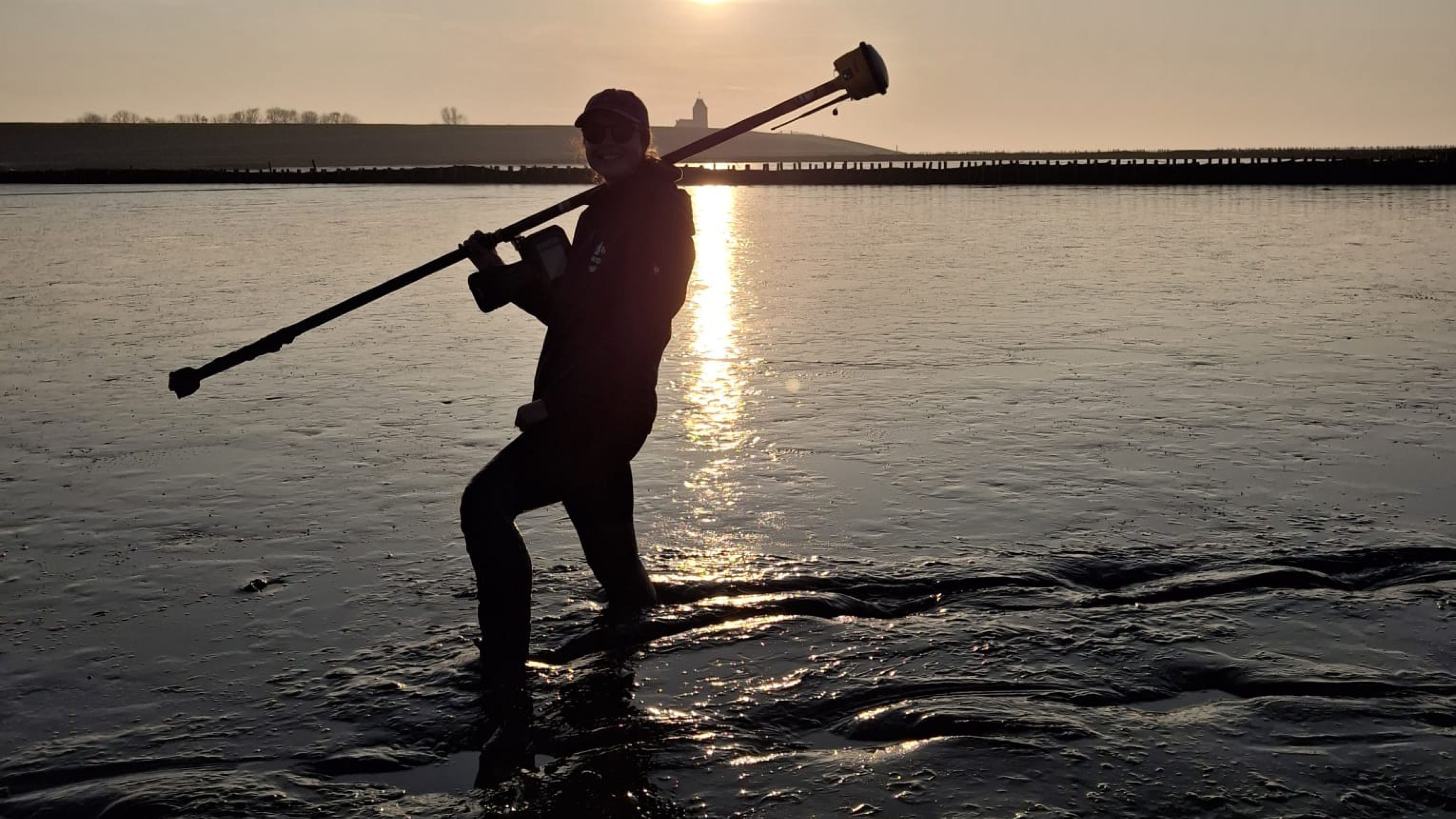Taking sunset dGPS measurements at Wierum, Dutch Wadden Sea, March 2025