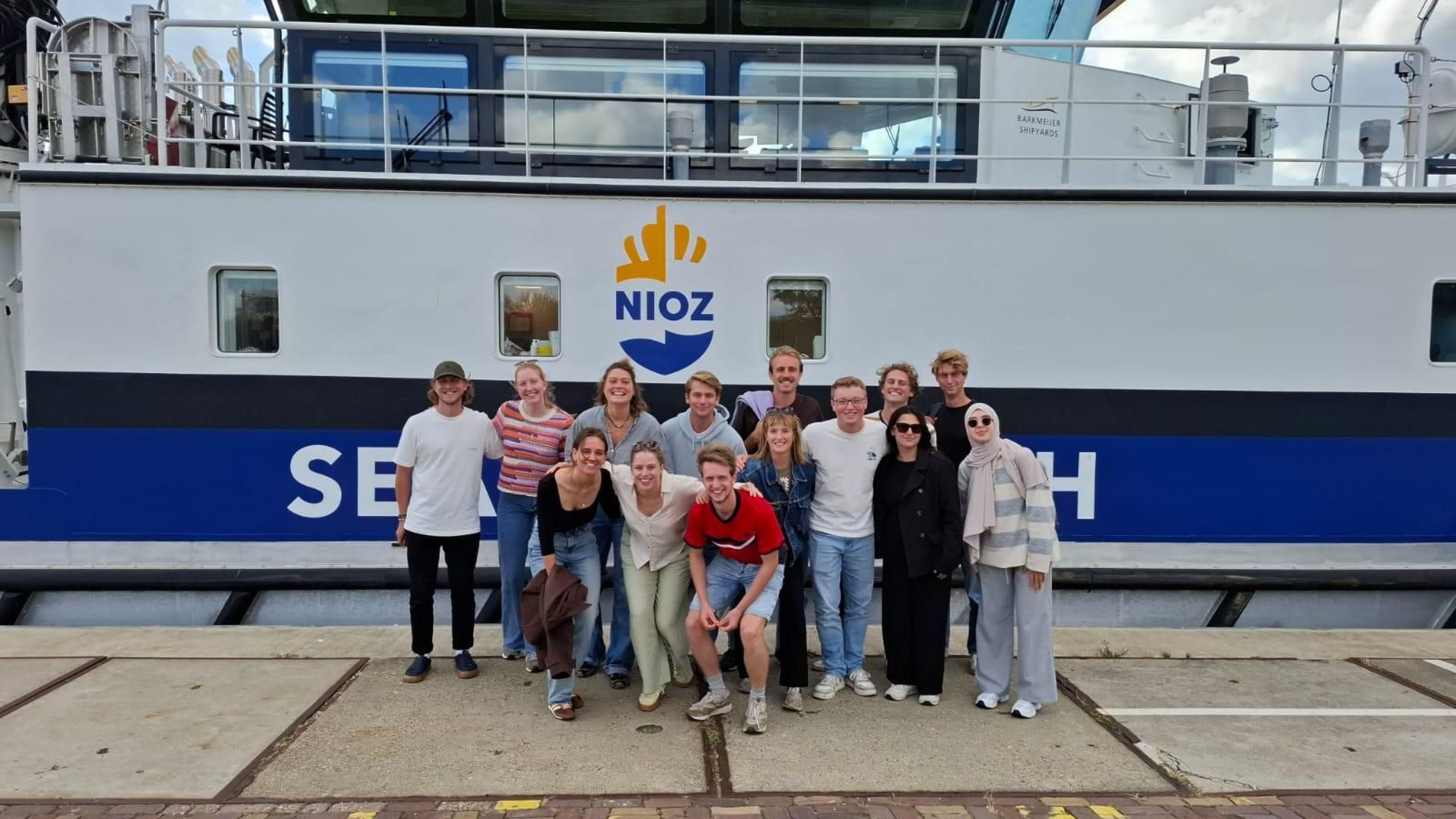 Photo of people in front of a reserach vessel, WiWocruise